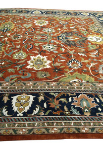 Close-up of the central medallion on an Oriental Serapi Palace Rug showcasing the detailed handwoven patterns and vibrant colors.