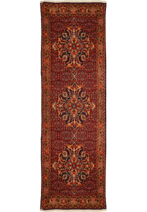 Full-length view of a 3 x 10 Persian Bijar Runner with intricate red, blue, and cream patterns