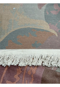 Edge detail of the Modern Art Deco Beijing rug, featuring the neatly tied off fringe and the sturdy backing material