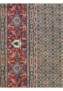Detailed shot of the Persian Moud Rug's border featuring ornate floral designs and prominent medallions against a deep red backdrop