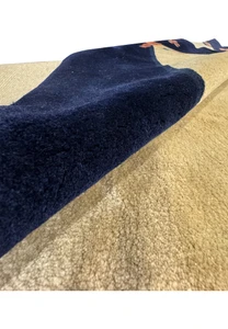 Detailed texture shot of a Vintage Art Deco Rug, showing the softness and intricate weave of the New Zealand wool in natural light