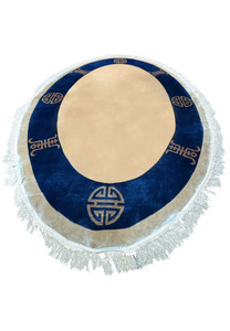 Artistic top view of a 4x6 oval silk rug featuring Asian eternity motifs and a contrasting deep blue border