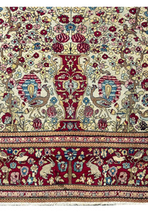 A zoomed-in view showcasing the detailed border design of the rug, with its traditional floral motifs and intricate patterns.
