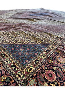 An impressive 12x17 Bijar Persian rug with an eye-catching central medallion, rich in traditional symbolism and intricate details, making it a testament to the enduring craftsmanship of the region