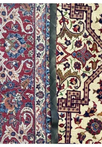 Macro shot of the intricate floral patterns on the border of a 10'7 x 14'7 Persian Isfahan Wool & Silk Rug, showing the detailed weave.