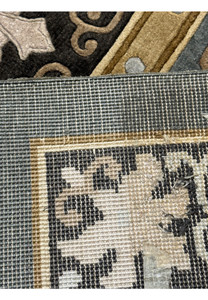 Macro detail of the Art Deco rug showcasing the fine silk work and the tight woolen weave.