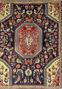 Close-up of the central medallion on the Persian Bidjar Rug, featuring intricate botanical motifs and vibrant colors.