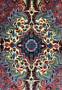 Detailed view of the medallion on the Persian Bidjar rug: This image provides a focused view of the central medallion, highlighting the complex design and vibrant color palette that includes shades of red, yellow, green, blue, and black.