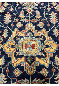 Close-up of the central medallion on a handmade Ziegler rug, showcasing detailed motifs and harmonious color combinations.