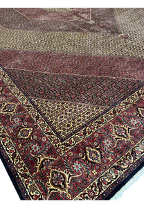 Top corner view of a 13x19'7 Persian Bijar Rug with intricate medallion and border patterns.