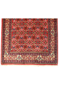 Border detail of the Persian Bijar runner rug, emphasizing the meticulous craftsmanship and intricate design elements in shades of red, blue, and ivory. The durability and high-quality materials are showcased.