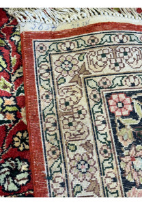 backside of 5x8 Kashmiri Oriental Rug highlighting the dense weave technique.