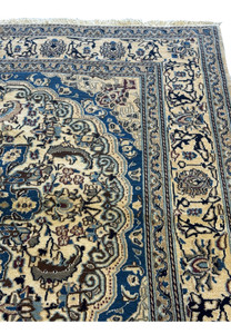 Zoomed-in view of the Persian Nain Square Rug's intricate patterns and color variations.