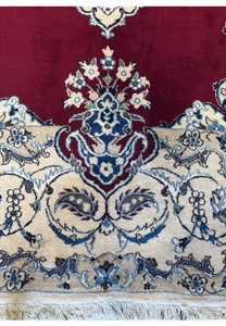 Detailed look at the lower edge of the 6'8 x 10'4 Persian Nain 9LAA Wool & Silk Rug, showing the fringe and border motifs.