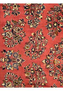 6'9 x 9'8 Persian Yazd rug displaying vibrant red field and symmetrical floral designs.
