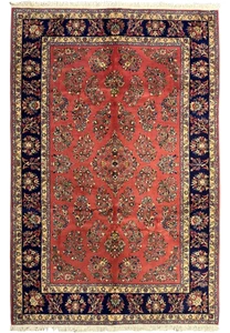 6'9 x 9'8 Persian Yazd rug with rich red field and intricate floral designs.