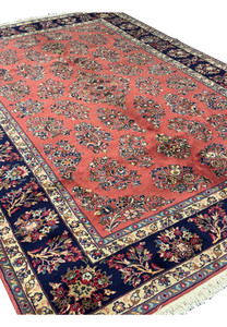Side angle of Persian Yazd rug, highlighting border and fringe details.