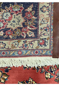 Back view of a 6'9 x 9'8 Persian Yazd rug showcasing the intricate knotting and high-quality craftsmanship, highlighting the rug's durability and fine detail.