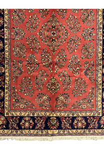 Close-up of the fringe on a Persian Yazd rug, demonstrating fine craftsmanship.