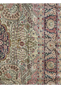 Midfield and border of a Persian Tabriz 100% silk rug showcasing floral and medallion design