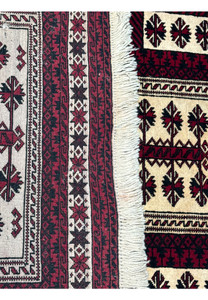 Reverse side of a 3'6 x 5'4 Persian Baluch Rug with visible craftsmanship and label.
