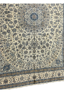 Symmetrical floral and vine motifs on a 13 x 19'6 Persian Nain 9LA Wool & Silk Rug