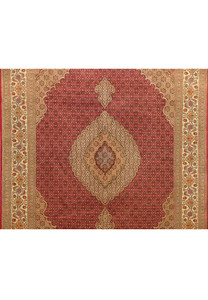 Close-up of the medallion of the 6'8 x 10 Persian Tabriz Mahi Rug, showcasing the intricate floral and geometric patterns.
