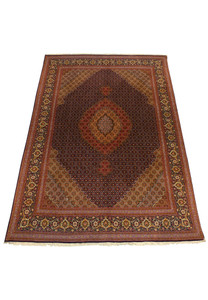 Laid down view of 6'8" x 9'7" Persian Tabriz Mahi 50 Raj Rug with detailed border and central medallion.