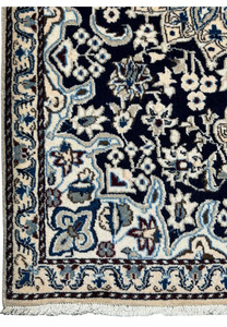 Border detail of the 3x5 Persian Nain rug with elaborate patterns.