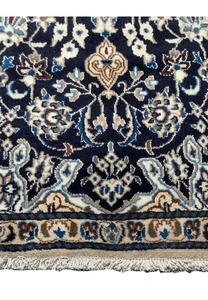 Lower part of the 3x5'3 Persian Nain Rug displaying the border and floral patterns in detail.
