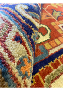 Close-up of the rolled edge of the 12' x 15' Oriental Serapi Rug with detailed patterning.