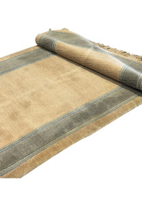 Rolled texture detail of a 2'8" x 28' Nepali runner showing fabric quality.