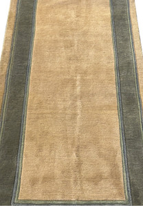 Midfield view of 2'8" x 28' modern Nepali runner with minimalistic design.