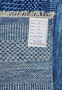 Backside of the blue 12x18 rug folded to show quality