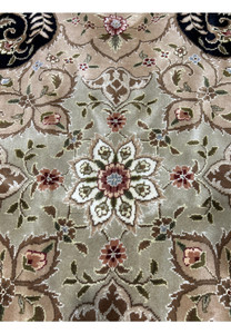 Floral detail of a 12'5" x 18' Persian Tabriz Rug, capturing the vibrant colors and elaborate patterns characteristic of Tabriz craftsmanship.