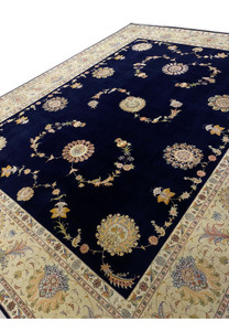 Angled view showing the exquisite borders and central medallion of a 10x13 Persian Tabriz rug