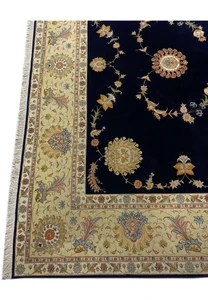 Elegant silk border detail on a 10x13 Persian Tabriz rug