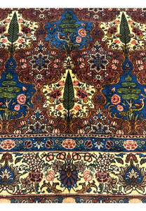 Pattern and motifs of a Persian Bakhtiar Rug, with cypress trees, birds, and florals in detailed hand-knotted design.