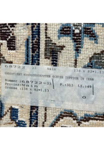 Tag of the 2'8 x 4'6 Persian Nain Rug detailing the size and origin of the hand-knotted wool rug from Nain, Iran.