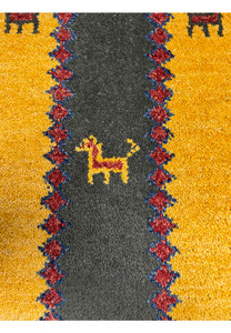 Close-up of central field showing animal motifs on Persian Gabbeh Poshti rug with olive green and yellow colors.