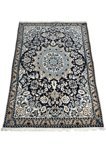 Laid flat view of 3'1 x 5 Persian Nain Rug with floral patterns and medallion.