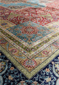 Hand-knotted silk fringe and edge of vintage Chinese oriental rug with Kurosh signature.