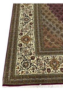 Detailed ivory border of 10x10 Tabriz 50 Raj Persian rug with scrolling vines, palmettes, and floral motifs framed in silk outlines.