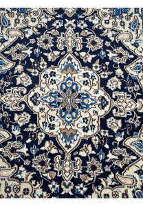 Medallion close-up of 3 x 4'8 Navy Blue Nain Persian Rug with floral details