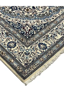 Edge of Square Persian Nain Rug showing fringes and layered floral borders