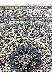 Upper edge and midfield of Square Persian Nain Rug, showcasing silk floral detailing