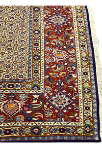 Close-up of Persian Moud rug border with terracotta and floral designs