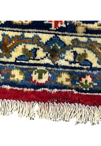 Macro close-up of the 8'7 x 12'7 Distressed Persian Isfahan Rug showing natural fading and wool patina, highlighting the authenticity of its aged Persian artistry.