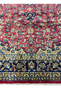 Bottom border detail with elegant floral chains and golden beige motifs against a navy background.