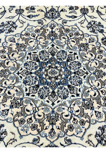 Close-up of 10' x 13'2 Persian Nain 9LA Rug medallion revealing fine silk outlines and detailed hand-knotted floral patterns.